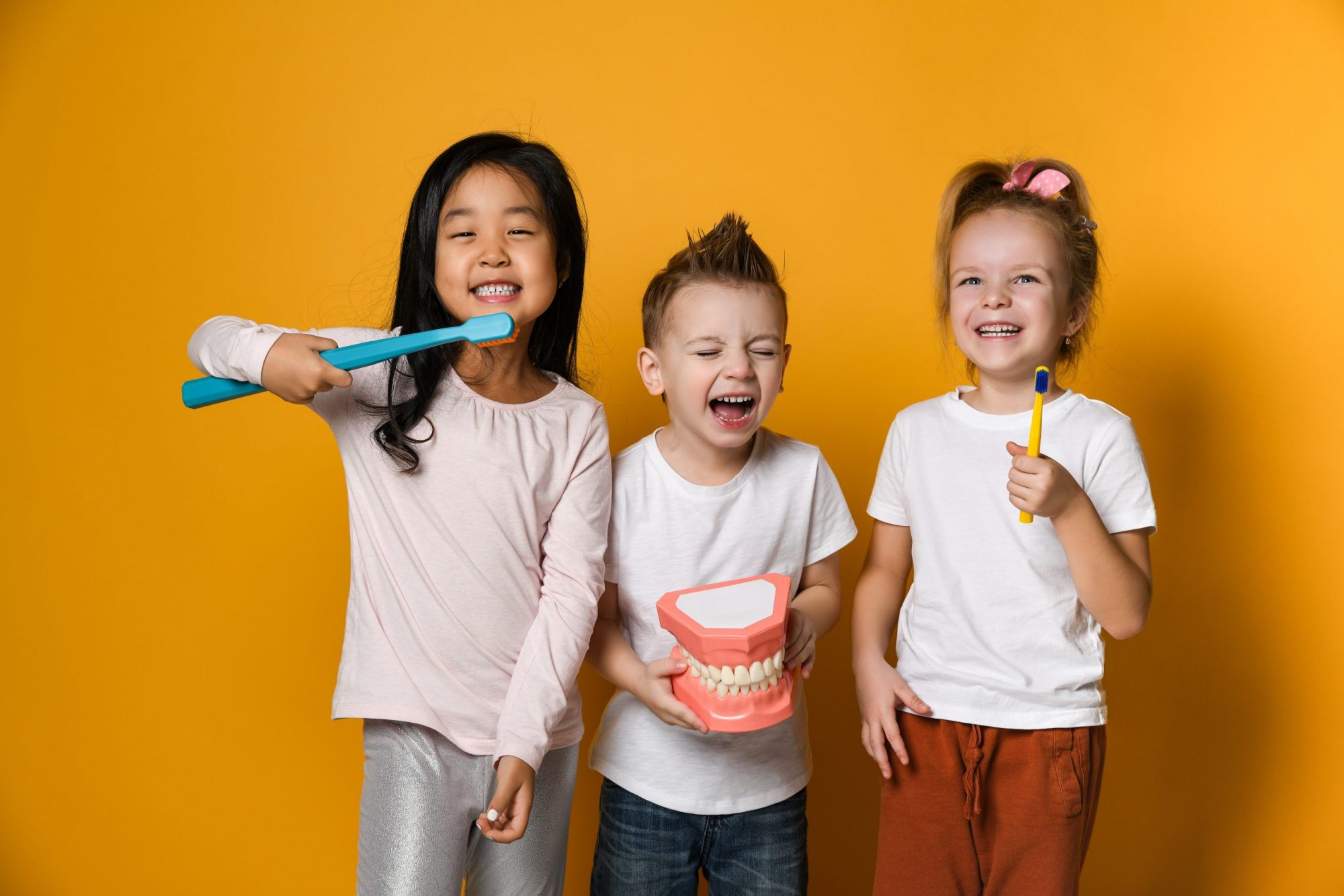 dental hygiene. happy little cute children with toothbrushes.